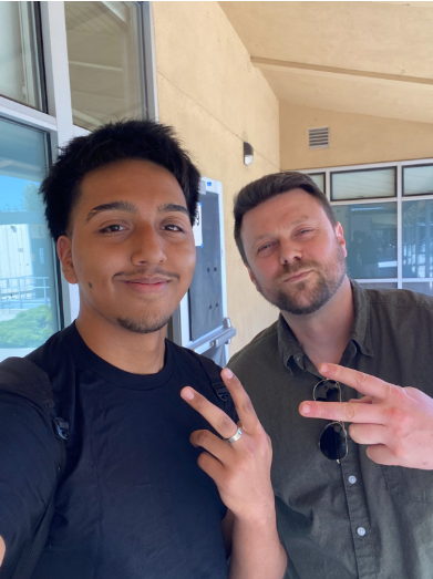 Abraham Morino (on the left) and Jay Grover (on the right) posing together for a selfie