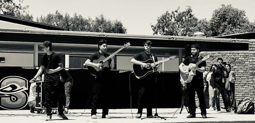 The Corridos club performing in the quad