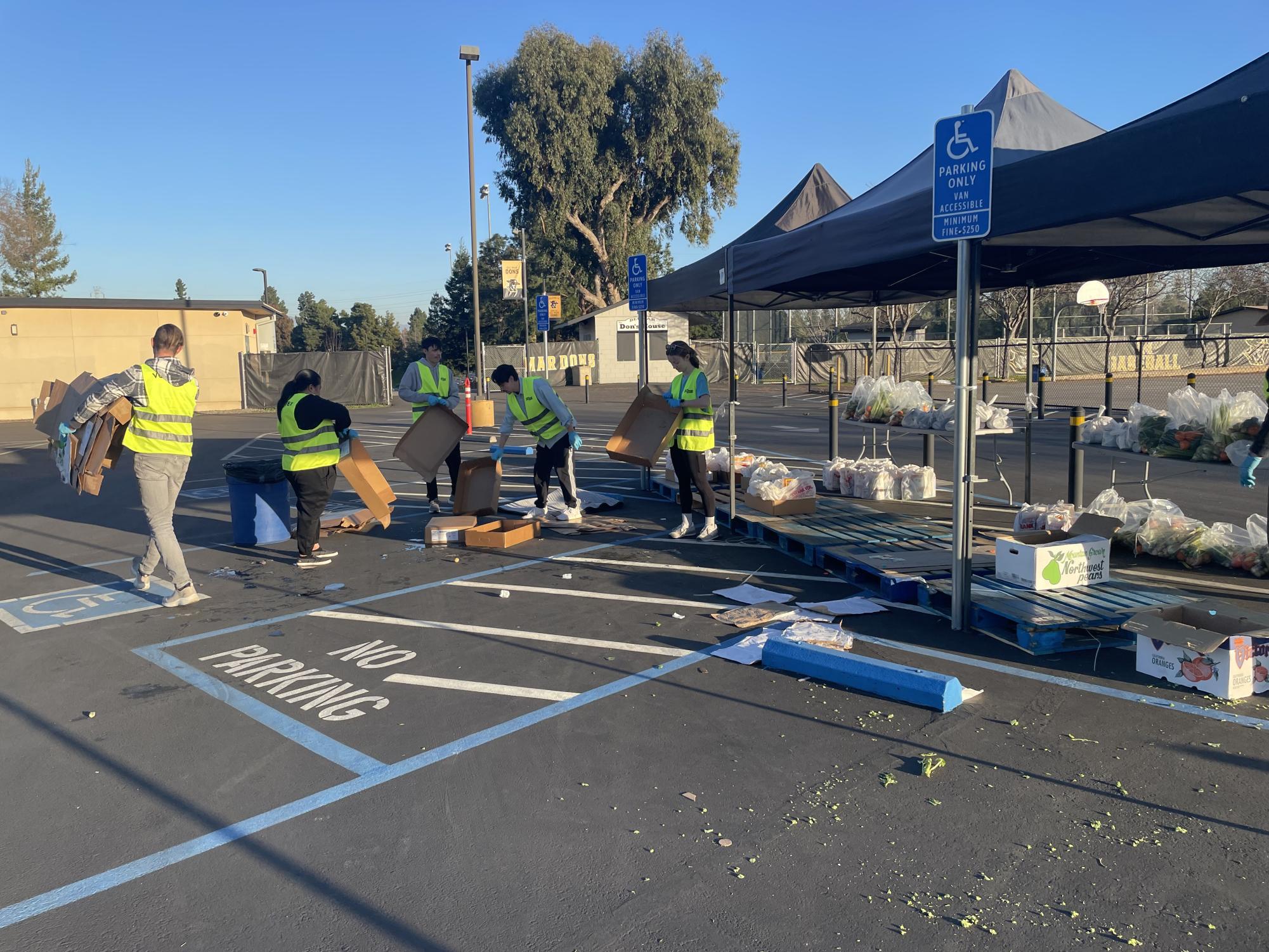 Community United: Volunteers Transform Parking Lot into Food Pantry