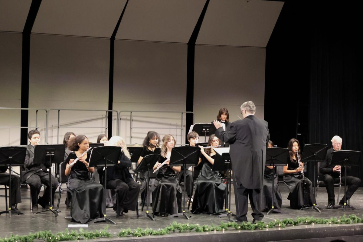 Mr. Burkhead serves as the conductor for his band.