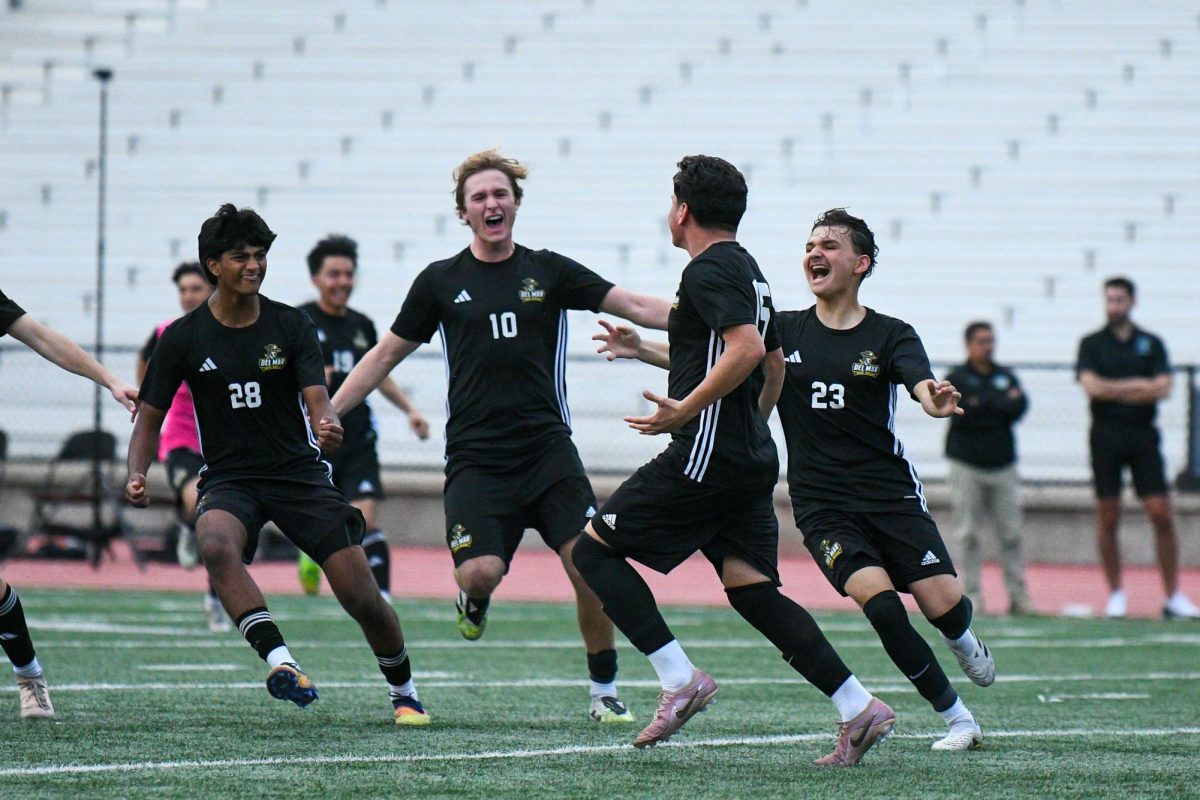 Kevin Garcia and teammates celebrating after the final penalty kick to win CCS