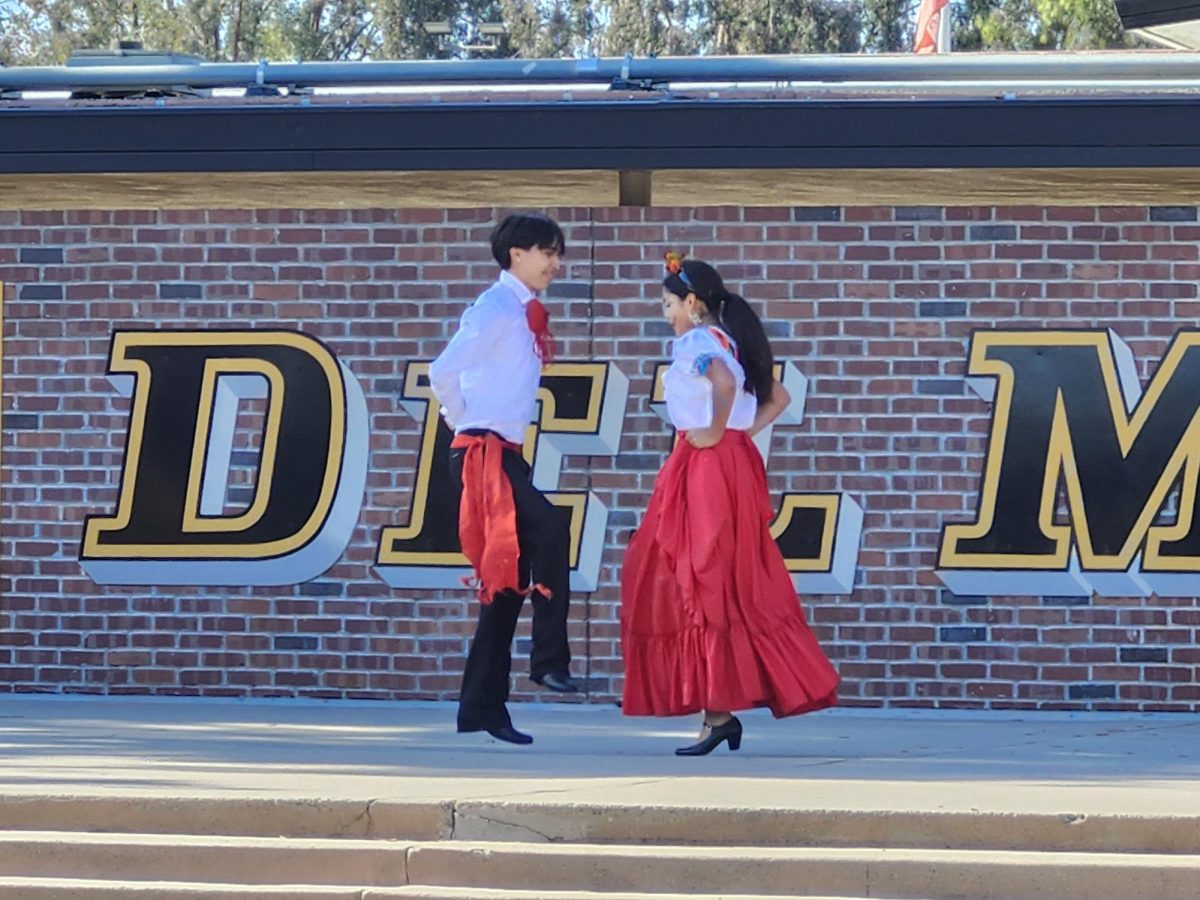 Senior folklorico dancers Marley Ruiz Aguilar and Saul Diaz Ortega dance at a lunch time performance. 