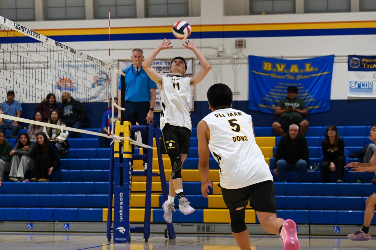 Setter Nikita Kovalchuk-Krymchak setting the ball to Middle Blocker Tecpa Romero.