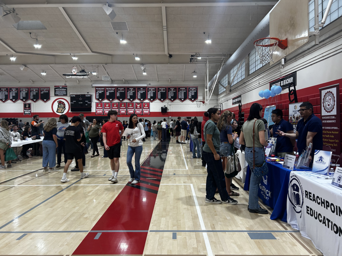Students and families exploring the Career Pathway Expo at Westmont High School.
